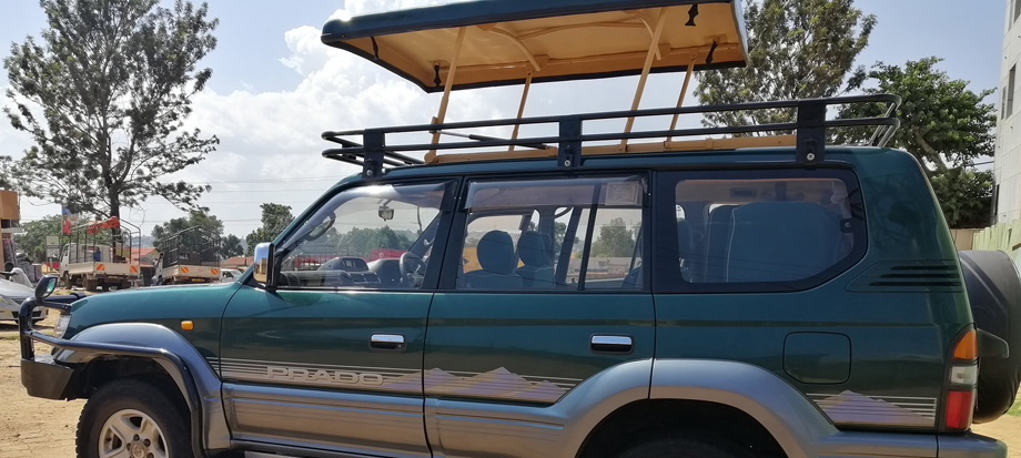 Best Safari Vehicles for National Parks and Off-Road Trips in East Africa - land-cruiser-tx-with-pop-pu-roof-car-rental-uganda